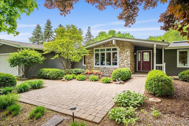 6N198 Old Homestead Rd, Saint Charles, IL 60175 - view of front of property with stone siding and a garage