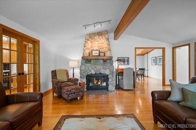 6N198 Old Homestead Rd, Saint Charles, IL 60175 - living area with wood finished floors, baseboards, and a stone fireplace