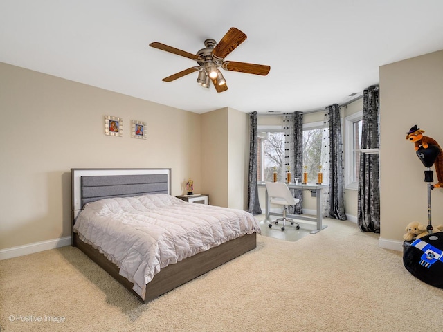 bedroom featuring carpet flooring, baseboards, and a ceiling fan