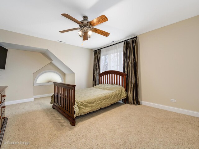 bedroom with baseboards, ceiling fan, light carpet, and visible vents