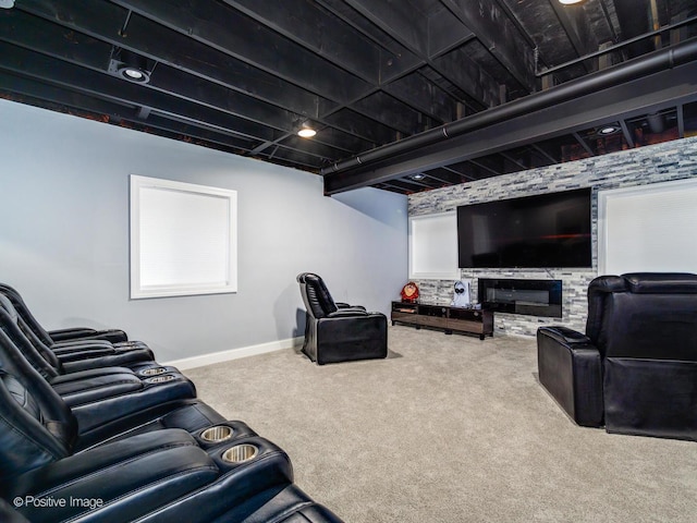 home theater with baseboards and carpet flooring