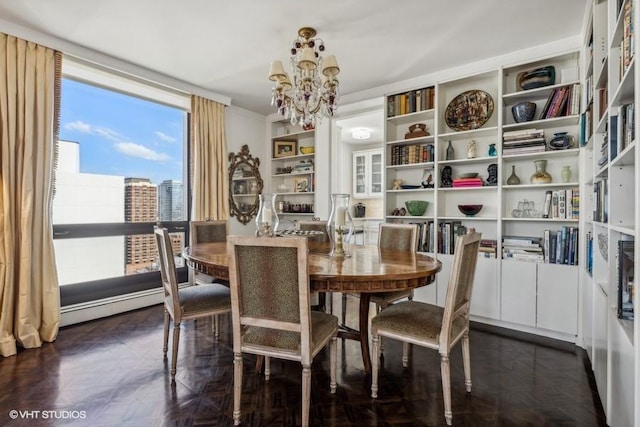 dining room with a chandelier and a baseboard radiator
