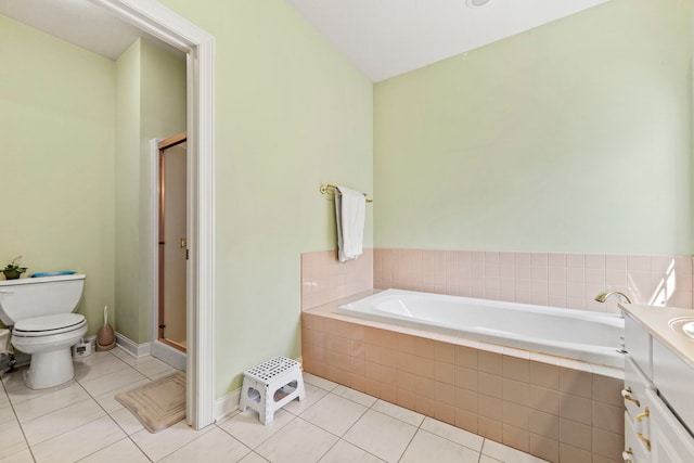 638 Roxbury Rd, Rockford, IL 61107 - bathroom featuring tile patterned floors, toilet, a shower stall, a garden tub, and vanity