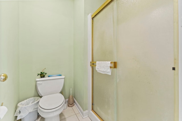 638 Roxbury Rd, Rockford, IL 61107 - bathroom featuring tile patterned flooring, toilet, a stall shower, and baseboards