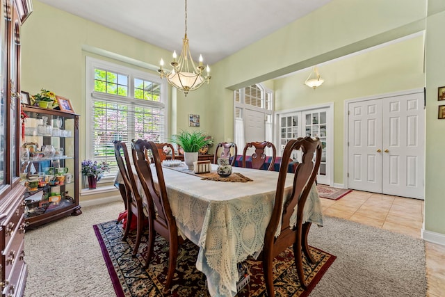 638 Roxbury Rd, Rockford, IL 61107 - dining room with a chandelier, french doors, baseboards, and light tile patterned floors