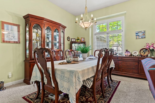 638 Roxbury Rd, Rockford, IL 61107 - dining space featuring a chandelier, light colored carpet, and baseboards