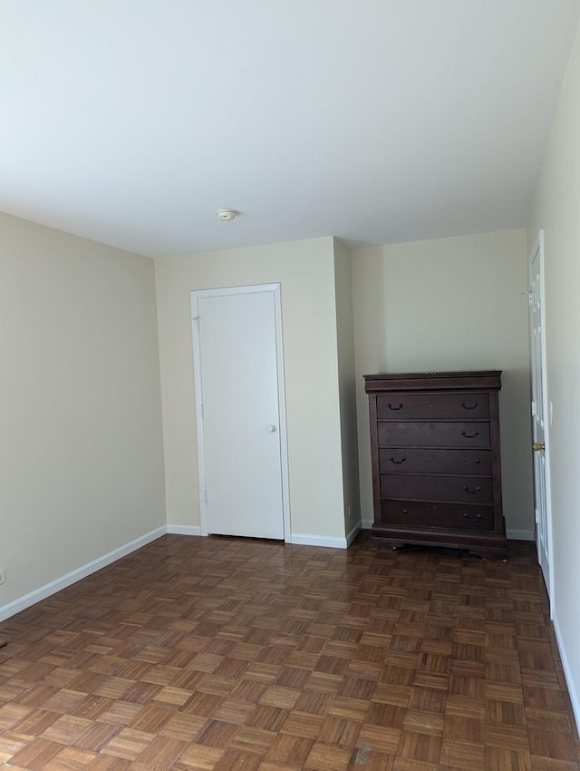 spare room featuring baseboards