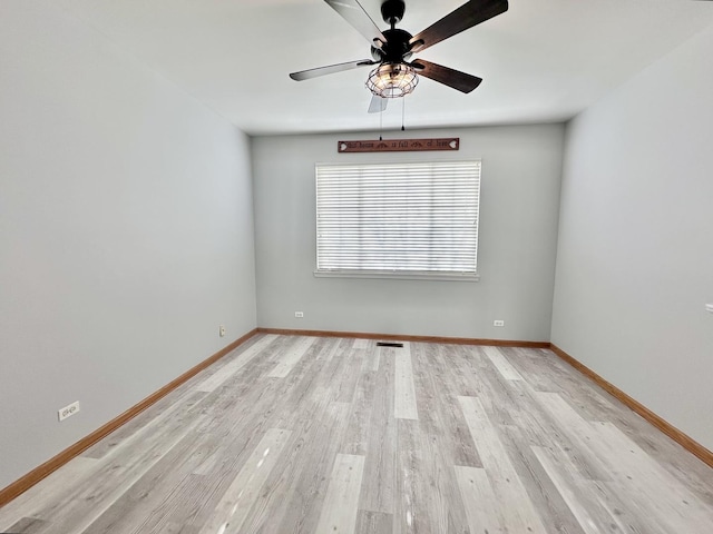 2278 Twilight Dr, Aurora, IL 60503 - unfurnished room with light wood finished floors, baseboards, and ceiling fan