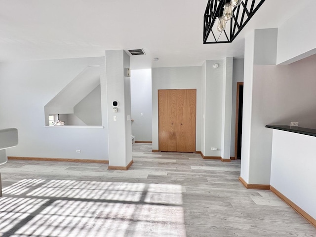 2278 Twilight Dr, Aurora, IL 60503 - bonus room featuring baseboards, light wood-style floors, and visible vents