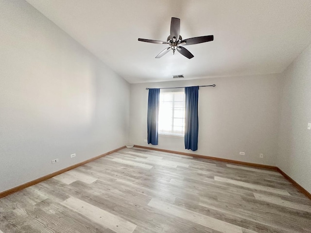 2278 Twilight Dr, Aurora, IL 60503 - unfurnished room with baseboards, visible vents, light wood-style flooring, and a ceiling fan