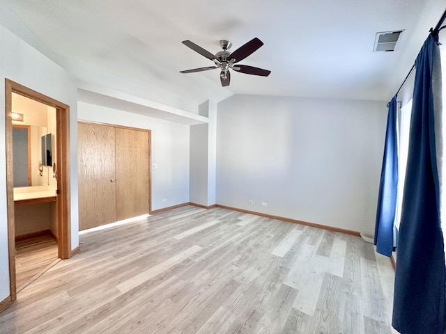 2278 Twilight Dr, Aurora, IL 60503 - unfurnished bedroom with light wood-style flooring, baseboards, ceiling fan, visible vents, and vaulted ceiling