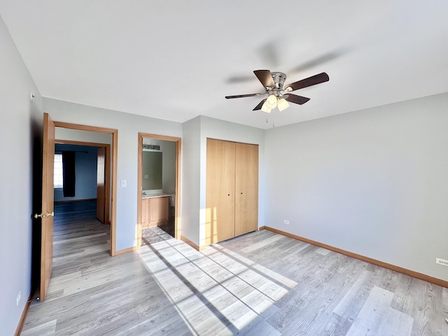 2278 Twilight Dr, Aurora, IL 60503 - unfurnished bedroom featuring baseboards, light wood finished floors, a closet, and a ceiling fan