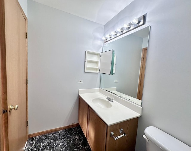 2278 Twilight Dr, Aurora, IL 60503 - bathroom with toilet, marble finish floor, baseboards, and vanity