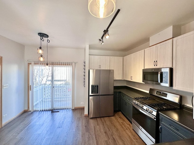 2278 Twilight Dr, Aurora, IL 60503 - kitchen with baseboards, dark countertops, appliances with stainless steel finishes, and wood finished floors