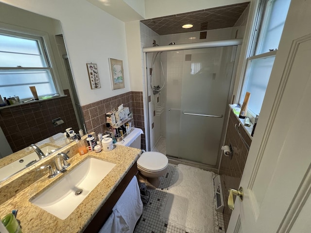 7924 Tripp Ave, Skokie, IL 60076 - full bathroom featuring a shower stall, tile walls, vanity, and toilet