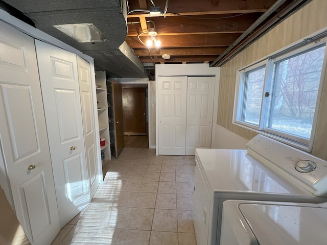 7924 Tripp Ave, Skokie, IL 60076 - laundry room with light tile patterned floors and washer and dryer