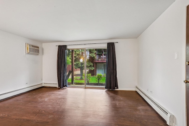 spare room featuring baseboards, baseboard heating, a wall mounted air conditioner, and wood finished floors