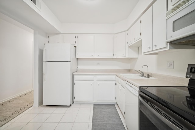 925 Spring Hill Dr Unit 211, Northbrook, IL 60062 - kitchen featuring white appliances, white cabinetry, light countertops, and light tile patterned floors