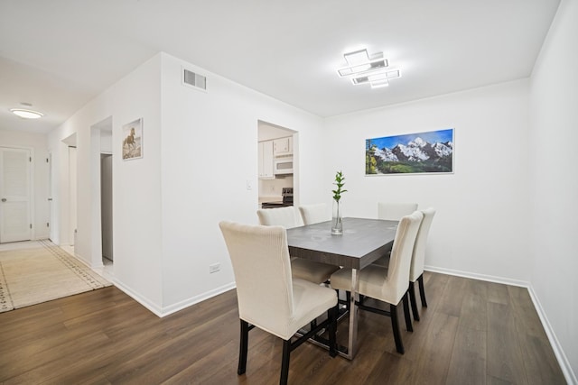 925 Spring Hill Dr Unit 211, Northbrook, IL 60062 - dining space with dark wood-type flooring and baseboards