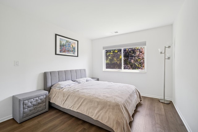 925 Spring Hill Dr Unit 211, Northbrook, IL 60062 - bedroom featuring dark wood finished floors and baseboards