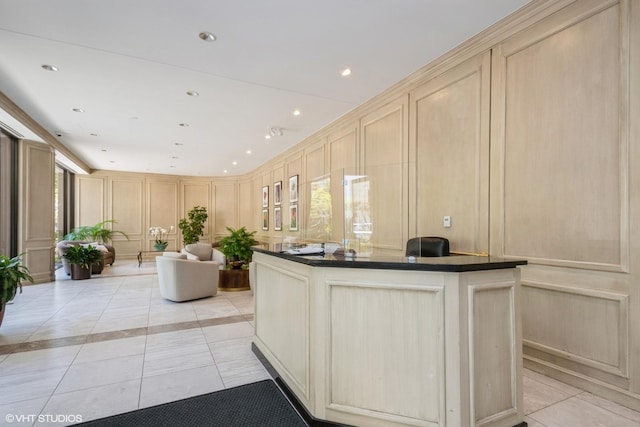 welcome area with a decorative wall and recessed lighting