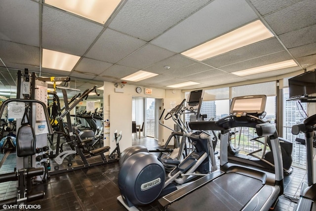 gym featuring a paneled ceiling