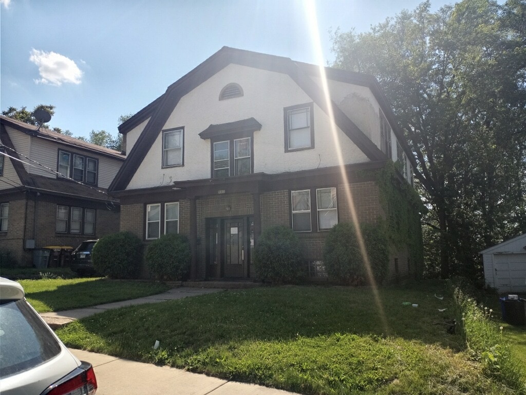 1230 Auburn Ct, Rockford, IL 61101 - dutch colonial featuring a front lawn and brick siding