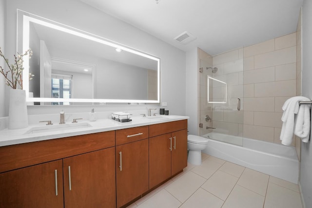 bathroom featuring toilet, a sink, visible vents, tile patterned flooring, and shower / bathing tub combination