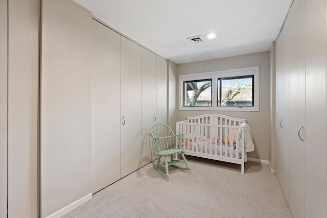 1805 Wildberry Dr Unit C, Glenview, IL 60025 - carpeted bedroom featuring a closet, a crib, and baseboards