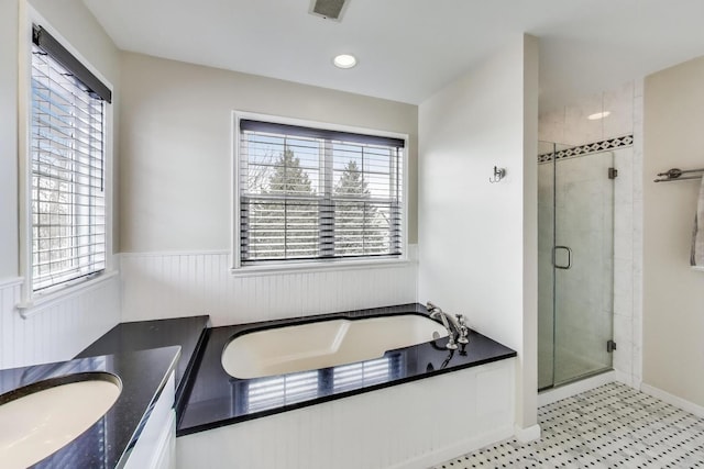 full bath featuring vanity, visible vents, a shower stall, wainscoting, and a bath