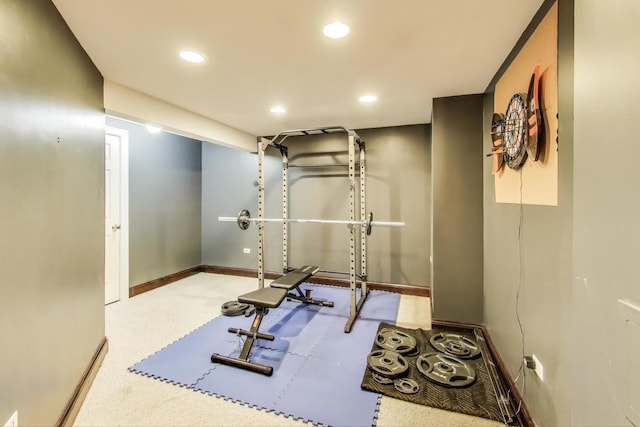 exercise area featuring baseboards and recessed lighting