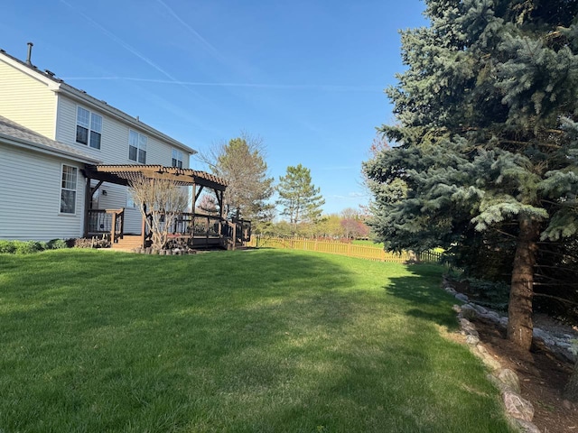 view of yard featuring fence, a pergola, and a wooden deck