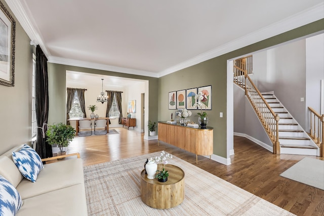 1669 Rolling Hills Dr, Crystal Lake, IL 60014 - living area with wood finished floors, stairway, a chandelier, ornamental molding, and baseboards
