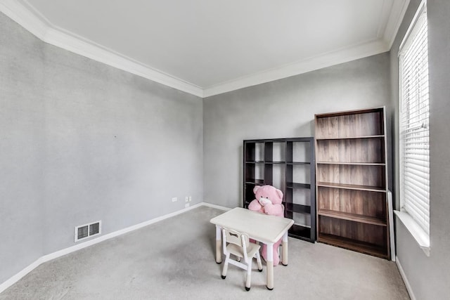 playroom featuring carpet flooring, plenty of natural light, and visible vents