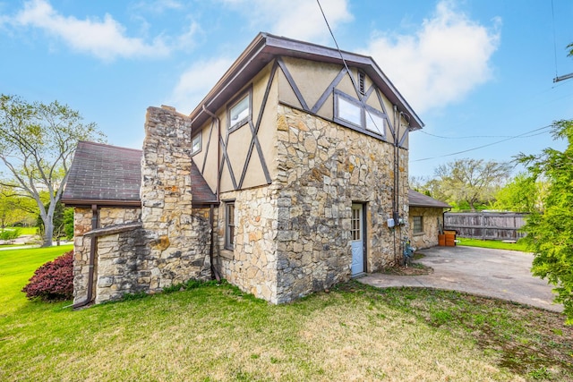 4703 Garfield Ave, Lisle, IL 60532 - rear view of property featuring stone siding, stucco siding, a patio, and a chimney