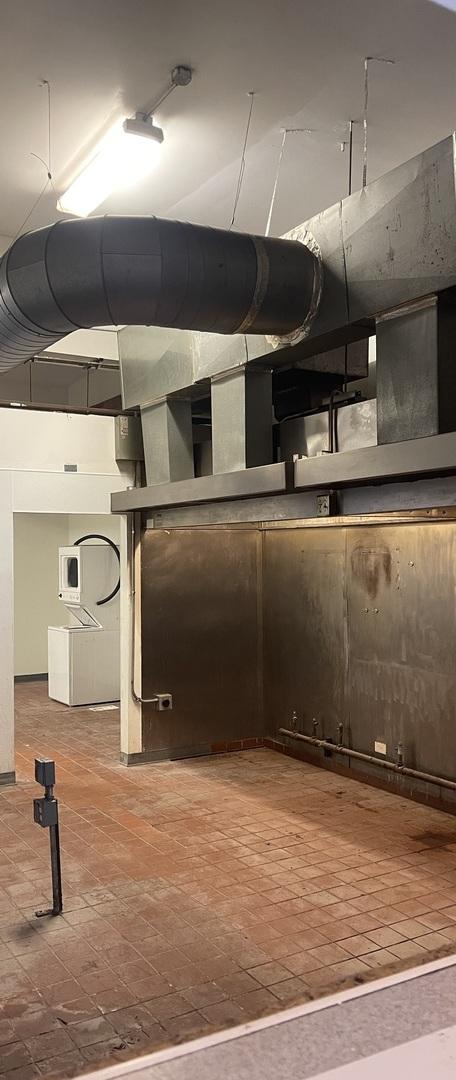 1625 N Halsted St, Chicago, IL 60614 - basement featuring washer / dryer and brick patterned floors
