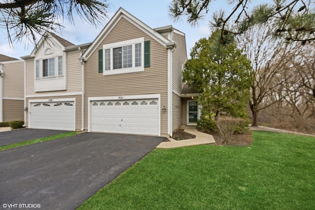 1601 Spaulding Rd, Bartlett, IL 60103 - view of front of house with an attached garage, a front yard, and aphalt driveway