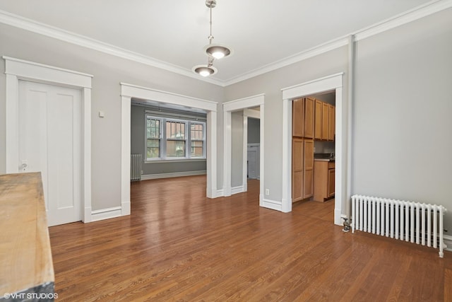6104 S Kimbark Ave Unit 1, Chicago, IL 60637 - empty room featuring radiator, crown molding, wood finished floors, and baseboards