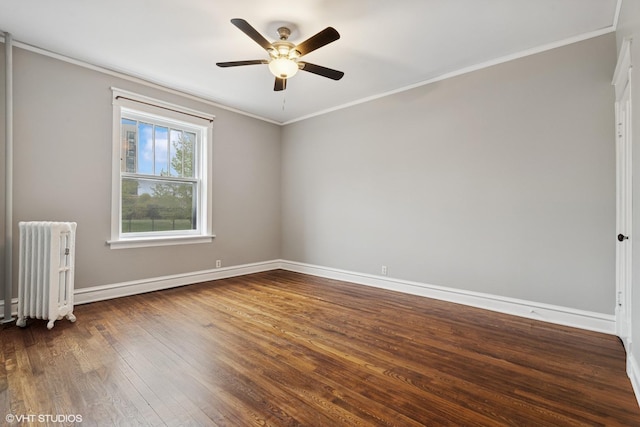 6104 S Kimbark Ave Unit 1, Chicago, IL 60637 - spare room featuring radiator heating unit, baseboards, wood finished floors, a ceiling fan, and crown molding