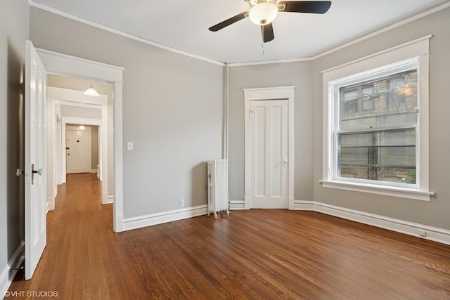 6104 S Kimbark Ave Unit 1, Chicago, IL 60637 - unfurnished bedroom featuring radiator heating unit, wood finished floors, ornamental molding, baseboards, and ceiling fan