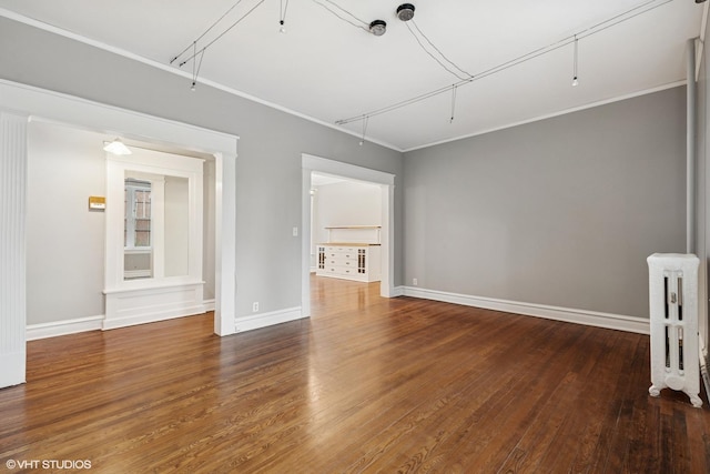 6104 S Kimbark Ave Unit 1, Chicago, IL 60637 - unfurnished room with attic access, baseboards, wood finished floors, radiator, and ornamental molding