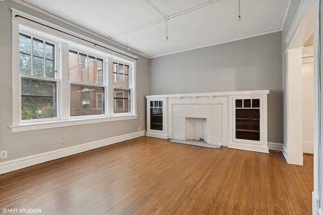 6104 S Kimbark Ave Unit 1, Chicago, IL 60637 - unfurnished living room with crown molding, wood finished floors, a fireplace, and baseboards