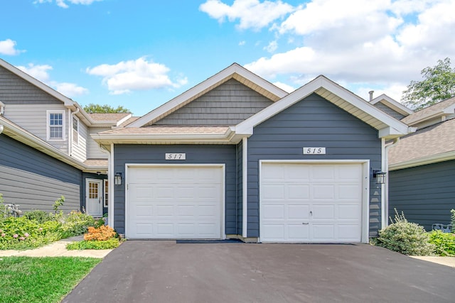 517 Woodcrest Dr, Mundelein, IL 60060 - view of front of property featuring asphalt driveway and an attached garage