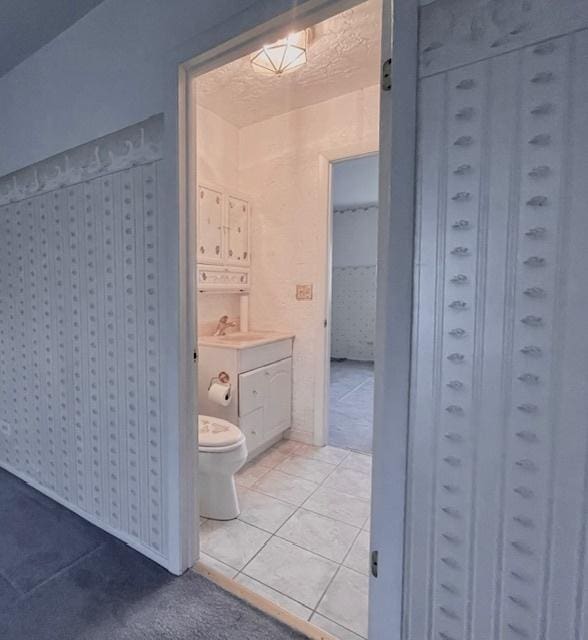 610 E Woodfield Trl, Roselle, IL 60172 - full bathroom with toilet, tile patterned flooring, and vanity
