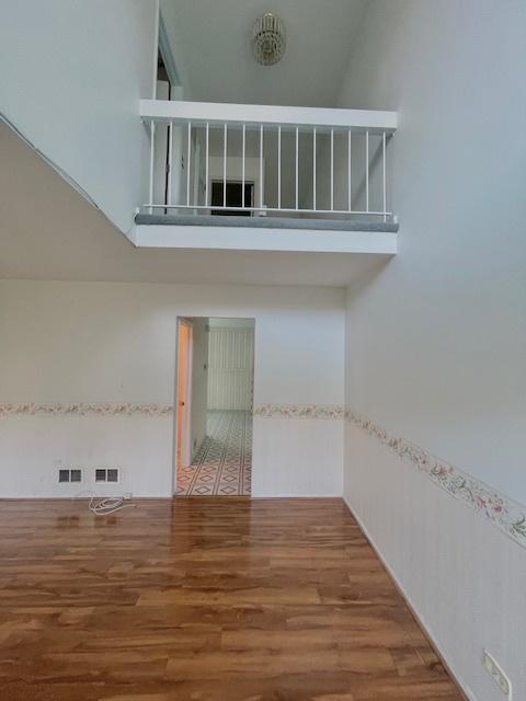 610 E Woodfield Trl, Roselle, IL 60172 - empty room featuring wood finished floors