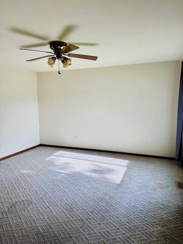 603 Kingston Dr, Romeoville, IL 60446 - carpeted empty room featuring a ceiling fan and baseboards