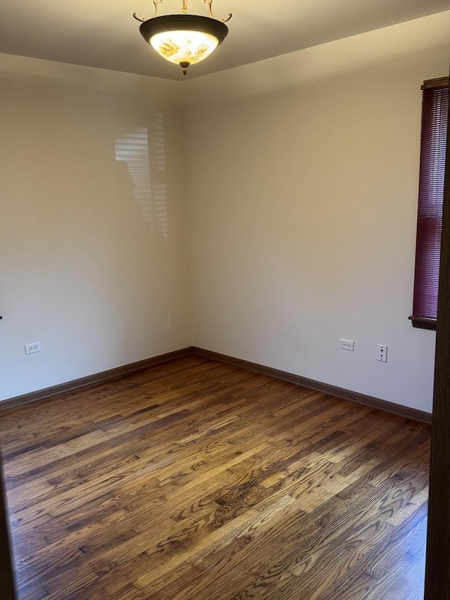 603 Kingston Dr, Romeoville, IL 60446 - unfurnished room with dark wood-style floors and baseboards