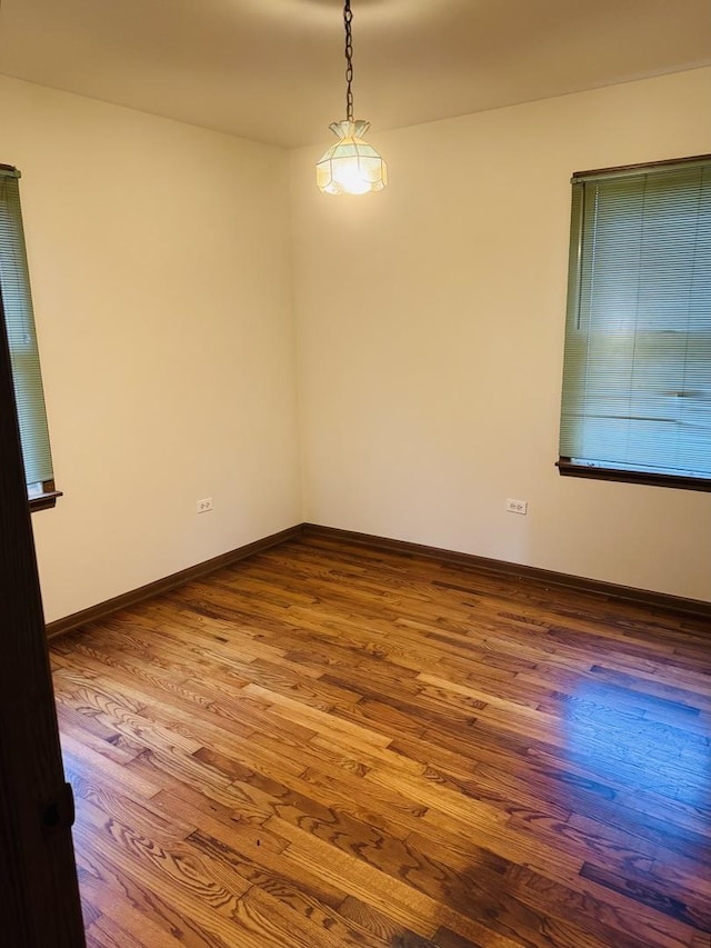 603 Kingston Dr, Romeoville, IL 60446 - unfurnished room featuring wood finished floors and baseboards