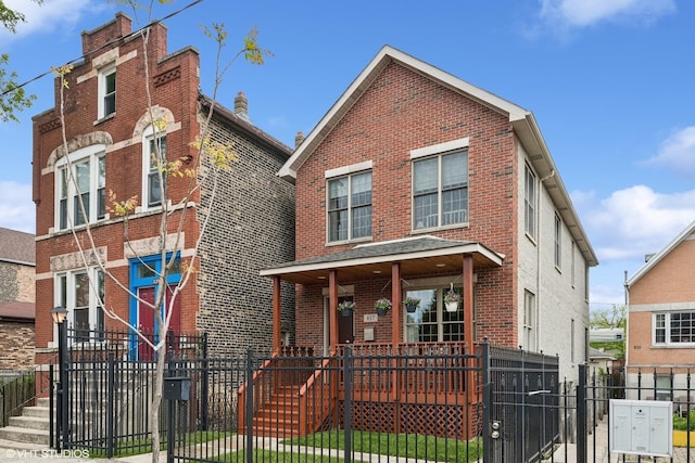 837 W 34th Pl, Chicago, IL 60608 - view of front of property featuring brick siding, a gate, a fenced front yard, and a porch