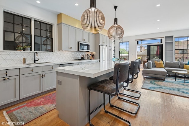 837 W 34th Pl, Chicago, IL 60608 - kitchen featuring a sink, gray cabinets, stainless steel appliances, plenty of natural light, and recessed lighting